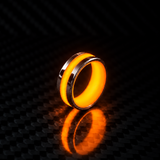 Apollo Lume Silver ring in orange glow, nighttime