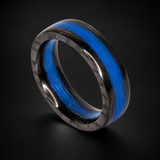 Blue Water Apollo carbon fiber ring with blue inlay on a dark background