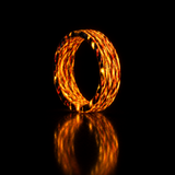 Fire Ghost Matrix carbon fiber ring glowing hot orange with hints of red and yellow against a pitch-black background