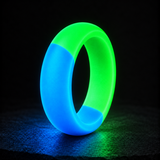 Halo Duality rounded ring glowing cyan blue and green on a dark graphite studio surface
