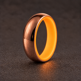 Luminescent Luxe 14K rose gold 5 mm ring with Racing Orange liner with a soft glow in dim light.
