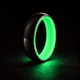 Luminescent Luxe 14K white gold 5 mm ring with Ultimate Green liner, glowing powerfully in deep darkness.