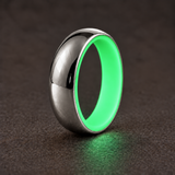 Luminescent Luxe 14K white gold 5 mm ring with Ultimate Green liner, glowing softly in dim light.