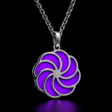 Sterling silver luminous spiral pendant in purple, shown in daylight
