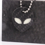 White carbon fiber alien keychain
