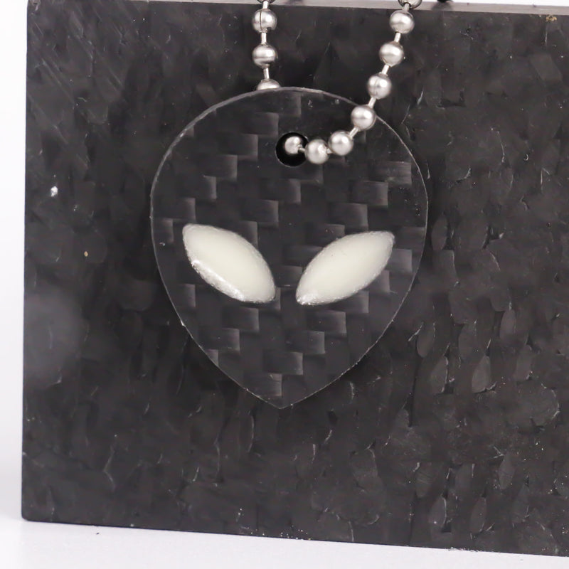 White carbon fiber alien keychain