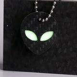 White carbon fiber alien keychain