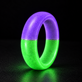 Joker Halo Ring standing upright and glowing purple and green with a thin clear resin divider