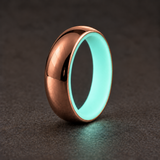 Luminescent Luxe 14K rose gold 5 mm ring with Aqua Glow liner with a soft glow in dim light.