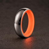 Luminescent Luxe 14K white gold 5 mm ring with Fire Glow liner, glowing softly in dim light.