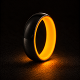 Luminescent Luxe 14K white gold 5 mm ring with Racing Orange liner, glowing powerfully in deep darkness.