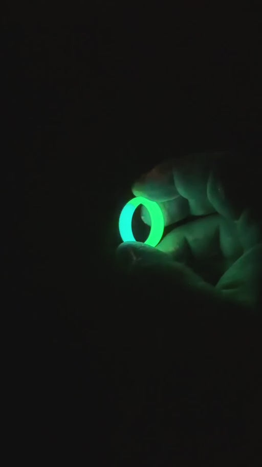 Halo Duality ring glowing blue and green after charging, filmed in the Rune Refinery workshop