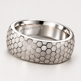The Hive sterling silver honeycomb ring on a light background