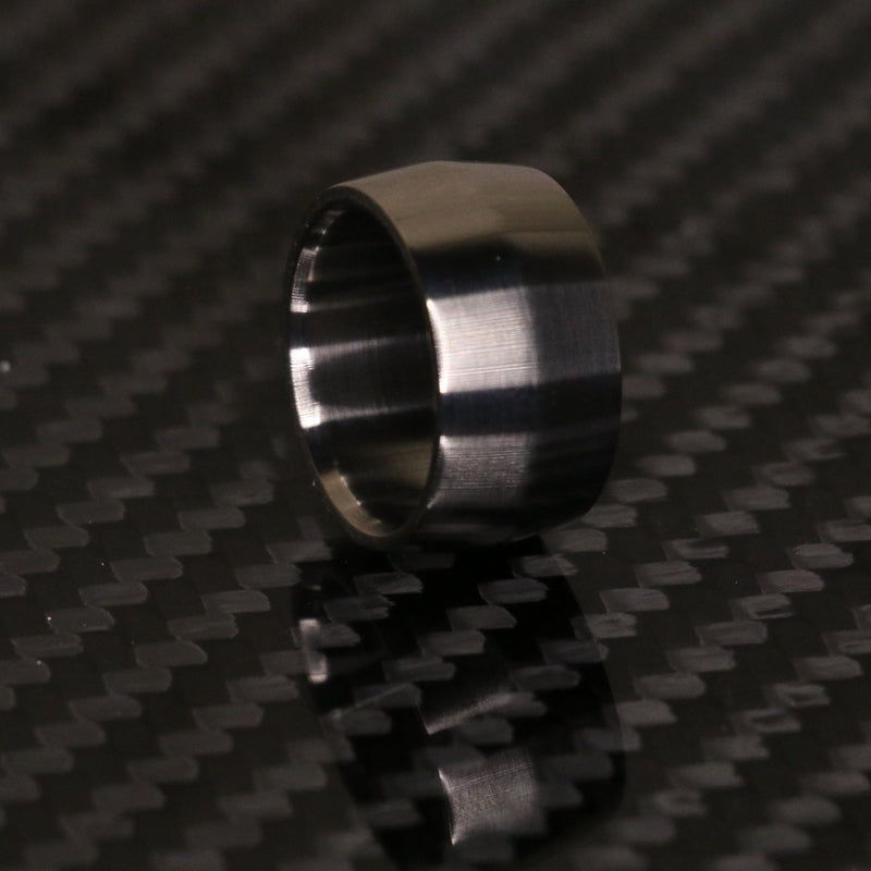 Edge profile broad titanium ring by carbon fi