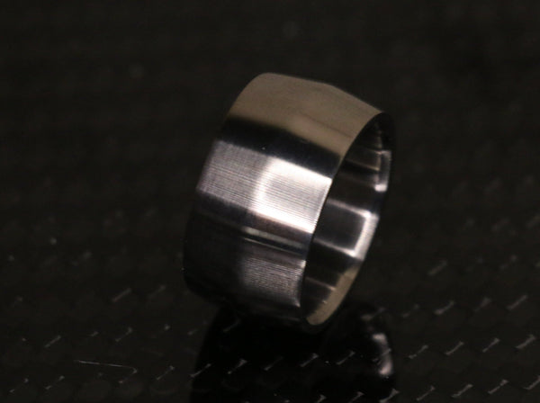Edge profile broad titanium ring by carbon fi